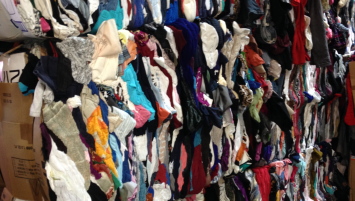 bales of torn and stained clothes
